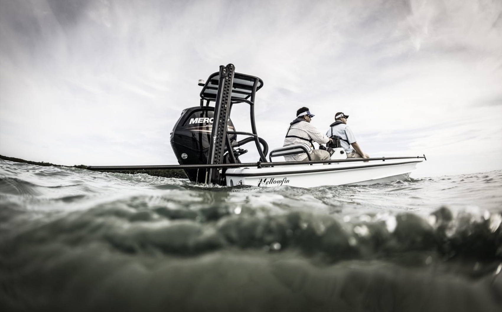 Flats boat with an outboard engine on calm water