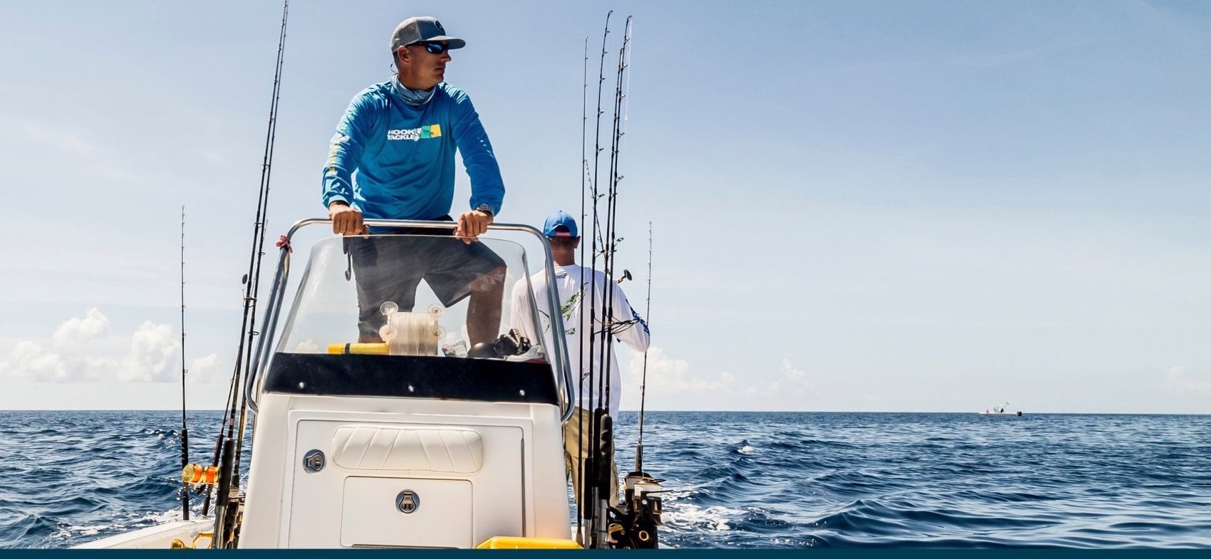 Angler on the bow of a bay boat offshore